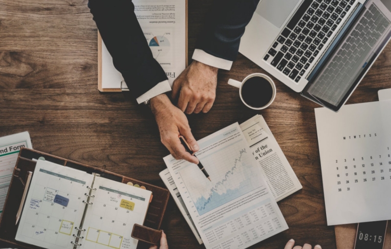 Professionals reviewing company performance and investment value